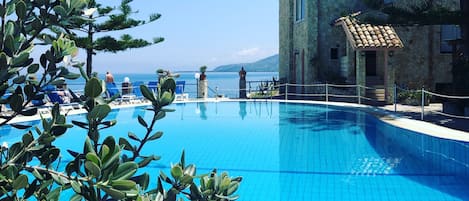 Seasonal outdoor pool, a rooftop pool, pool umbrellas, sun loungers