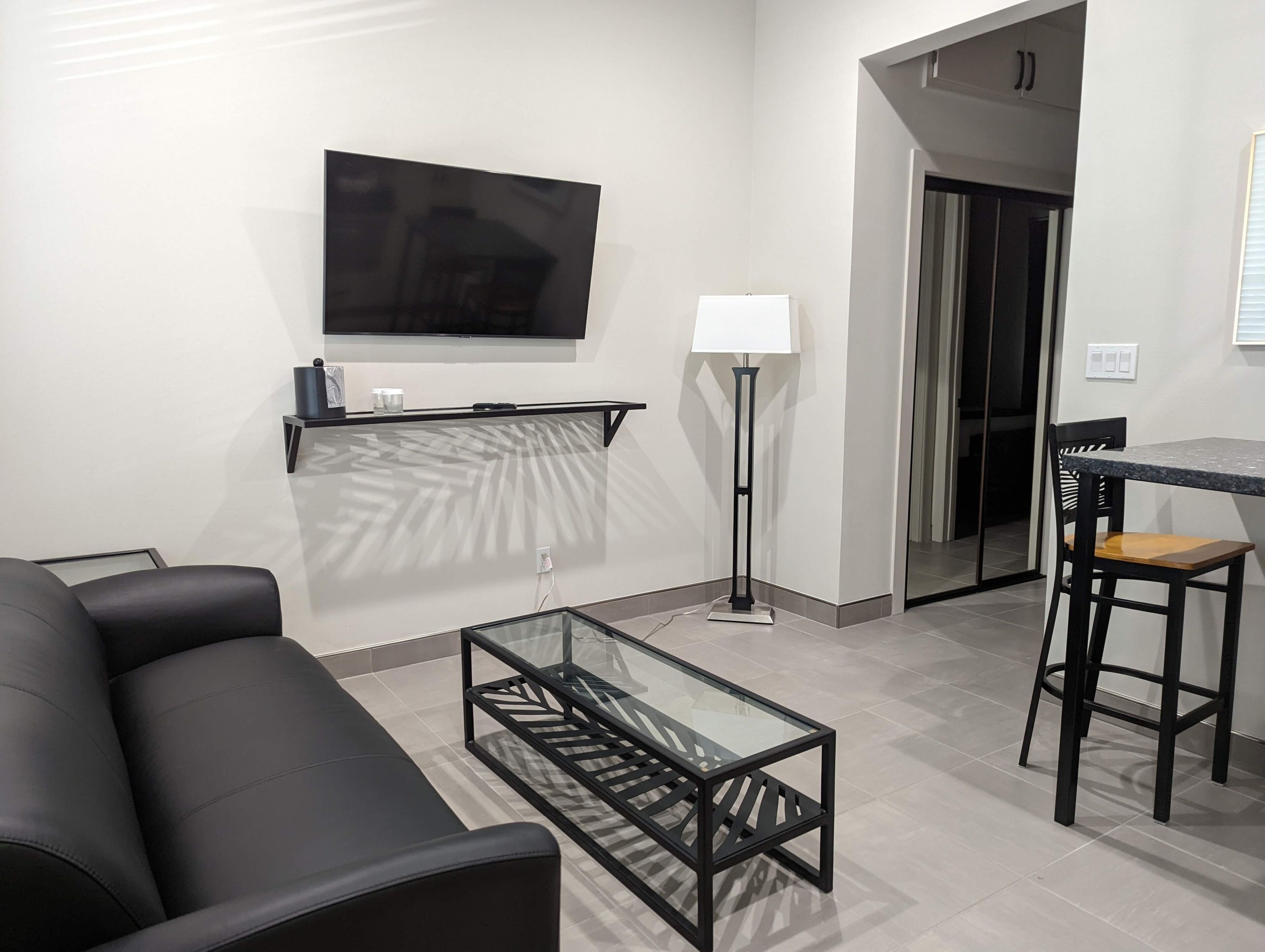 king bed suite | living area | flat-screen tv