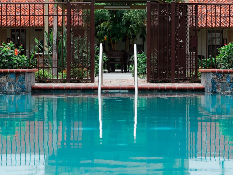 Outdoor pool, open 10 AM to 10 PM, pool umbrellas, pool loungers