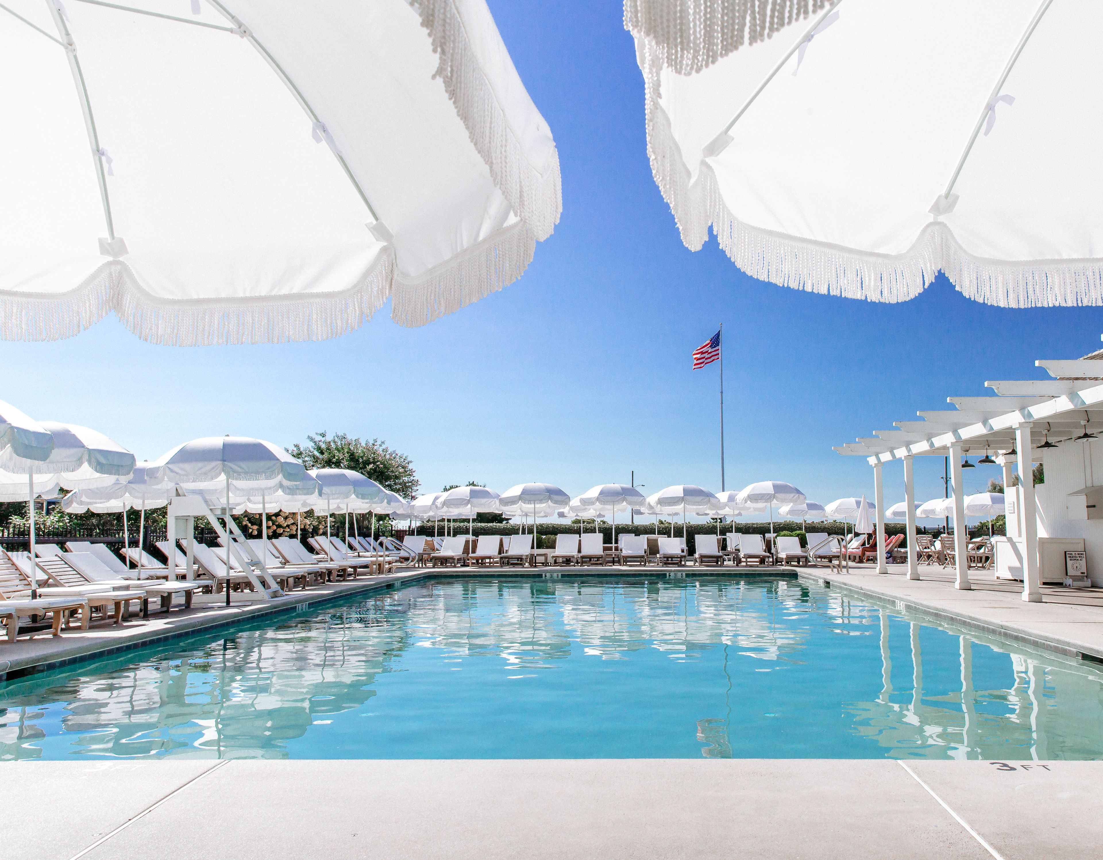 seasonal outdoor pool, open 8 am to 6:00 pm, pool umbrellas