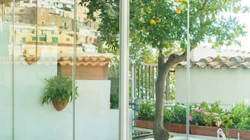 Deluxe Double Room, Patio | Minibar, in-room safe, individually furnished, desk