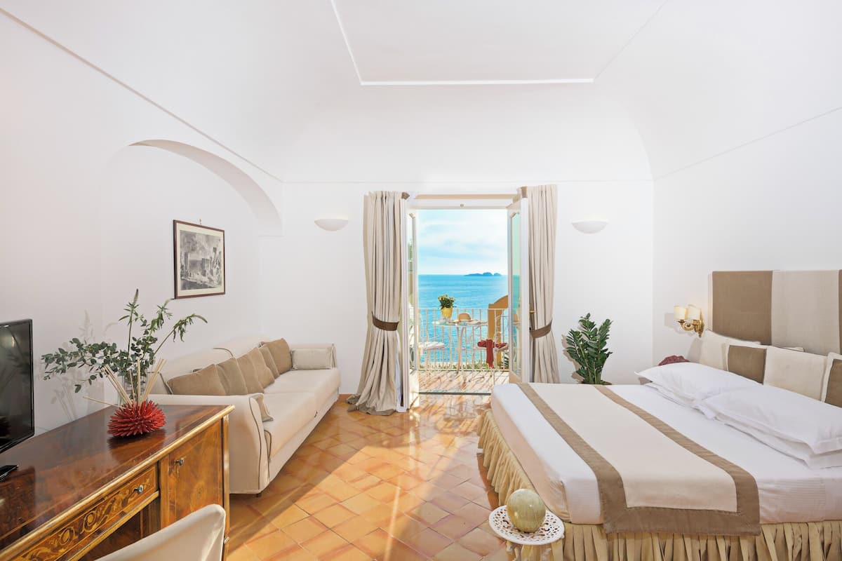 Classic Double Room, Balcony, Sea View | Minibar, in-room safe, desk, blackout drapes