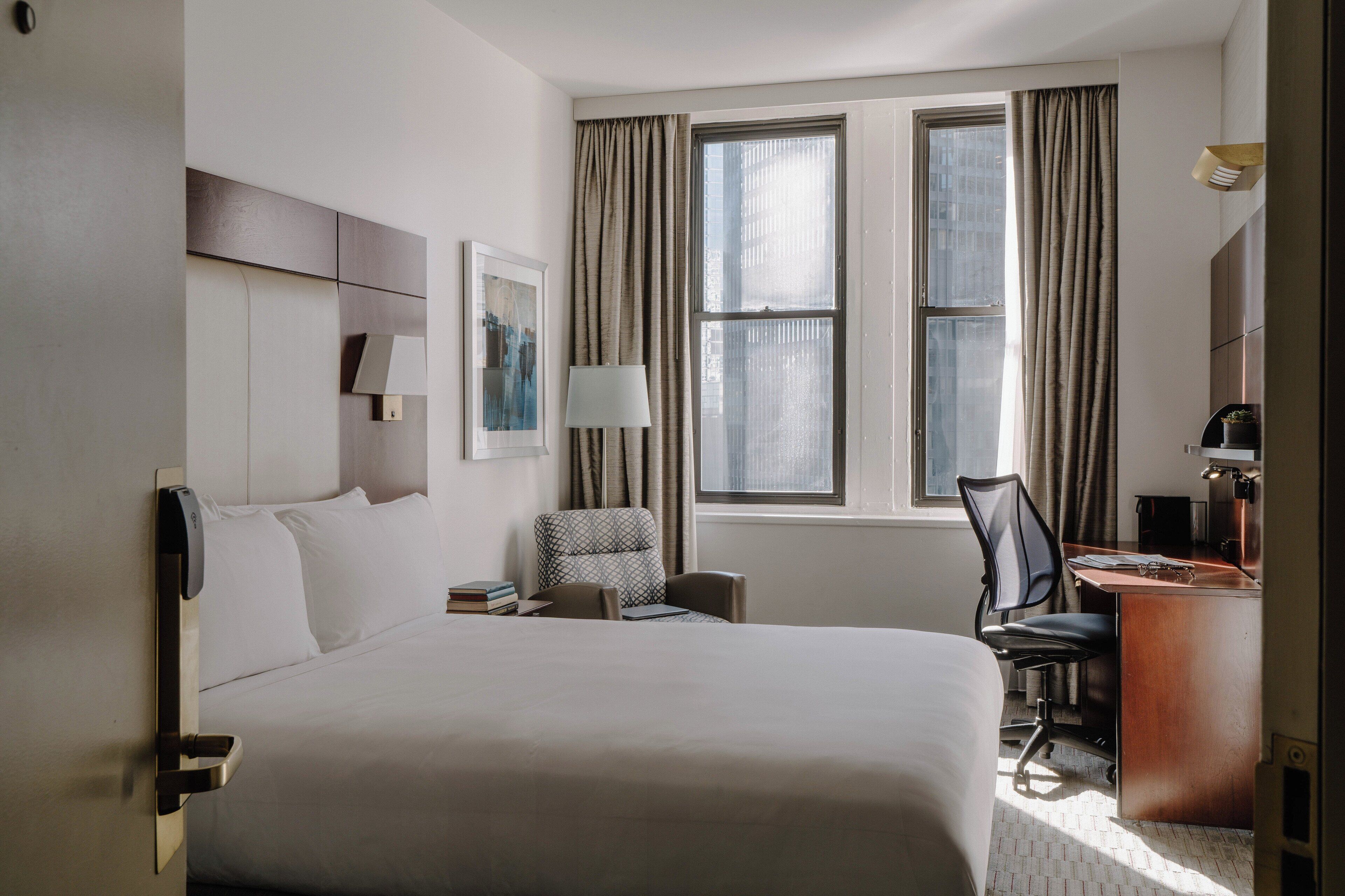 premium bedding, desk, laptop workspace, blackout curtains