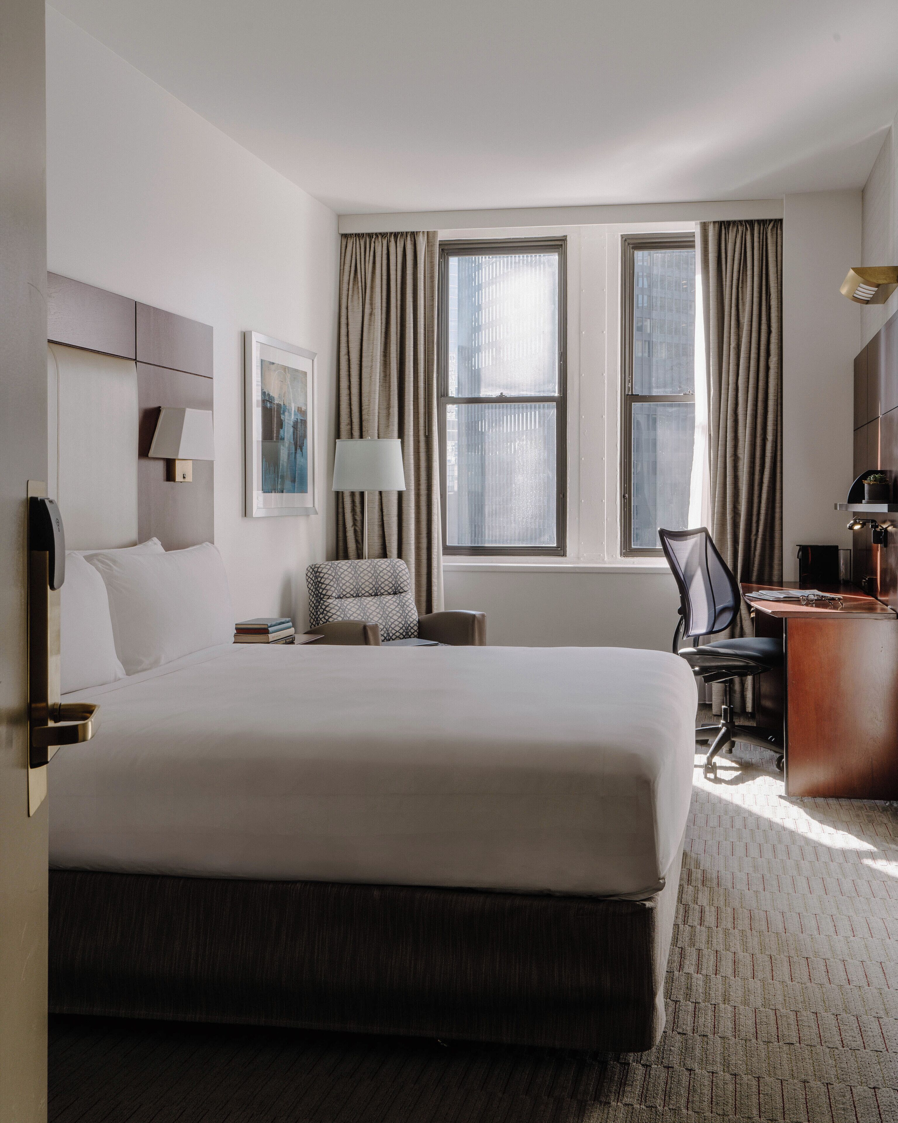 premium bedding, desk, laptop workspace, blackout curtains