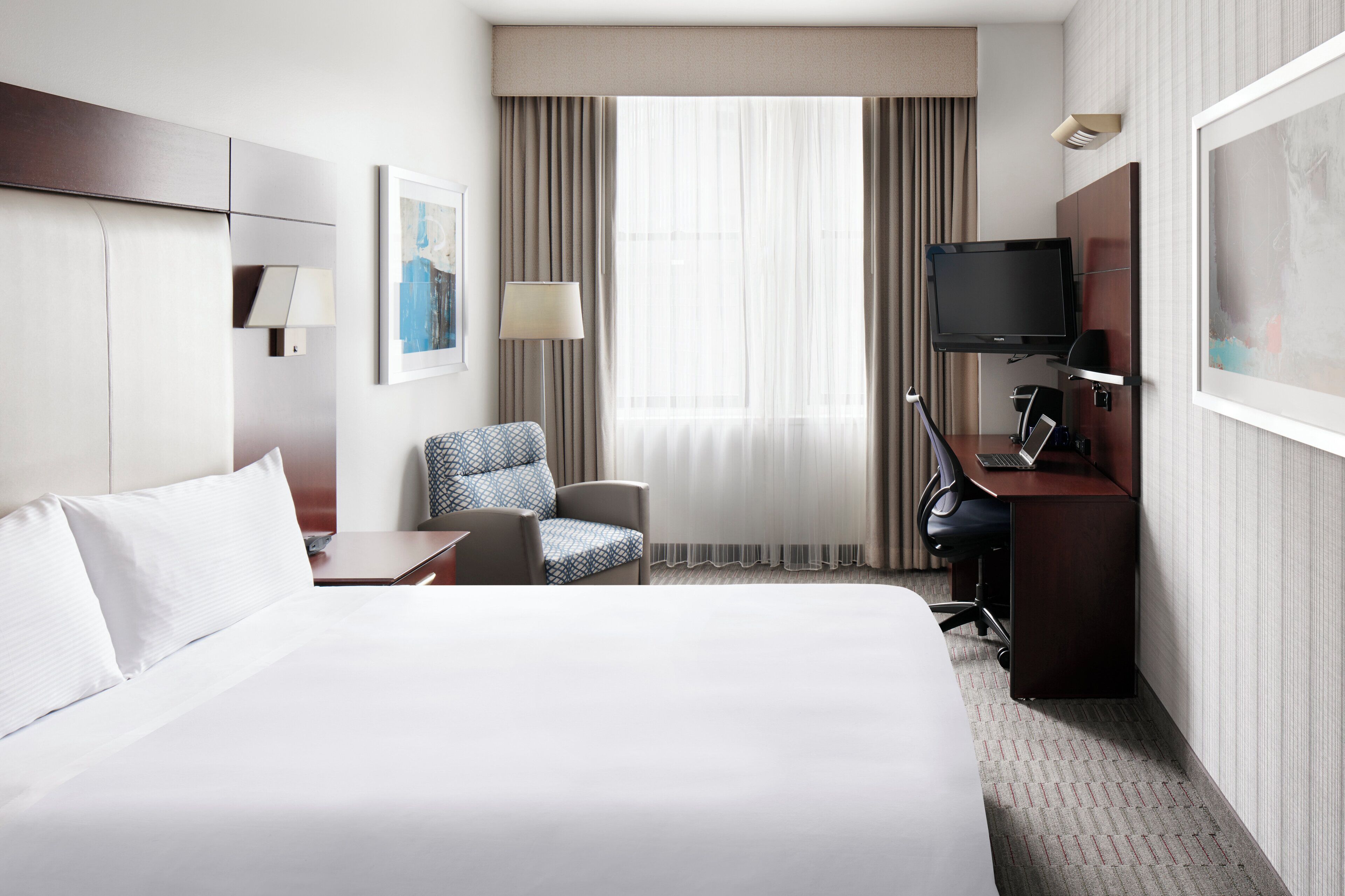 premium bedding, desk, laptop workspace, blackout curtains