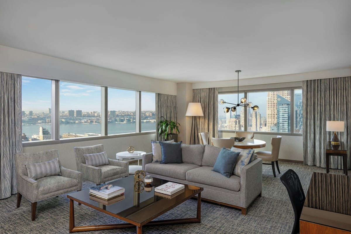 Suite, 1 Bedroom, River View | Living area | 32-inch TV with cable channels, iPod dock, pay movies