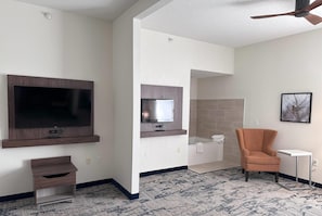 Premium bedding, desk, laptop workspace, blackout drapes