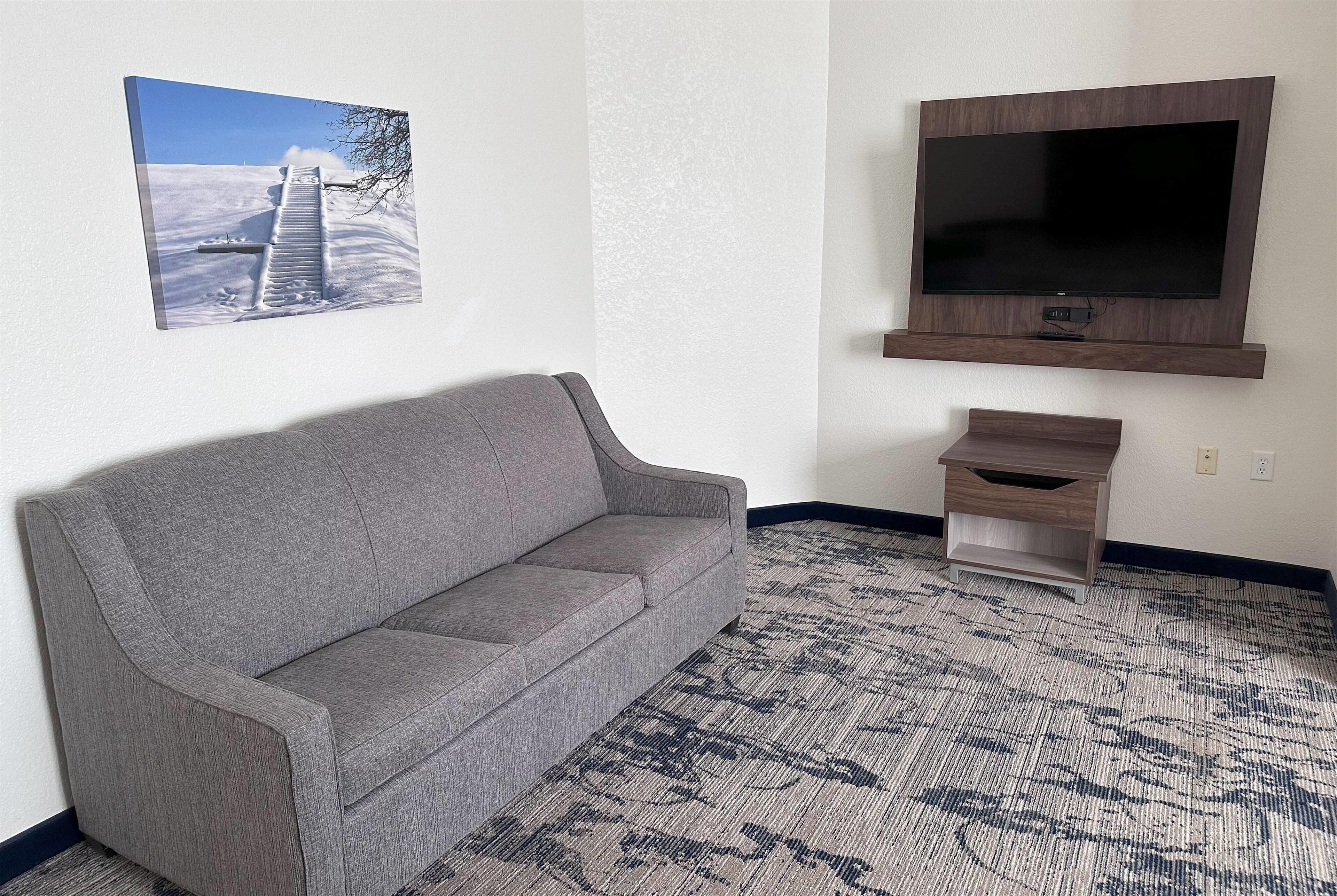 Premium bedding, desk, laptop workspace, blackout curtains