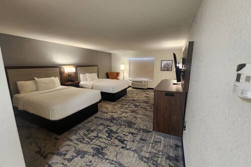 Premium bedding, desk, laptop workspace, blackout curtains