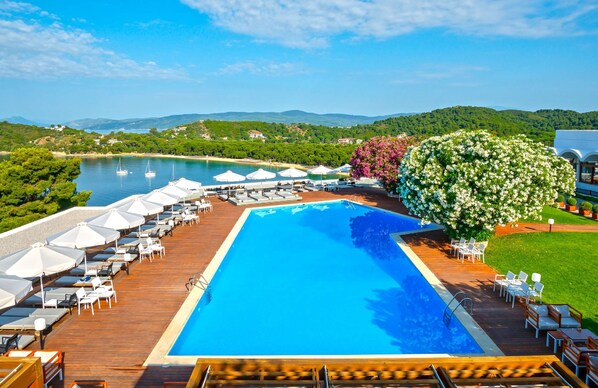 Outdoor pool, open 10:00 AM to 8 PM, pool umbrellas, pool loungers