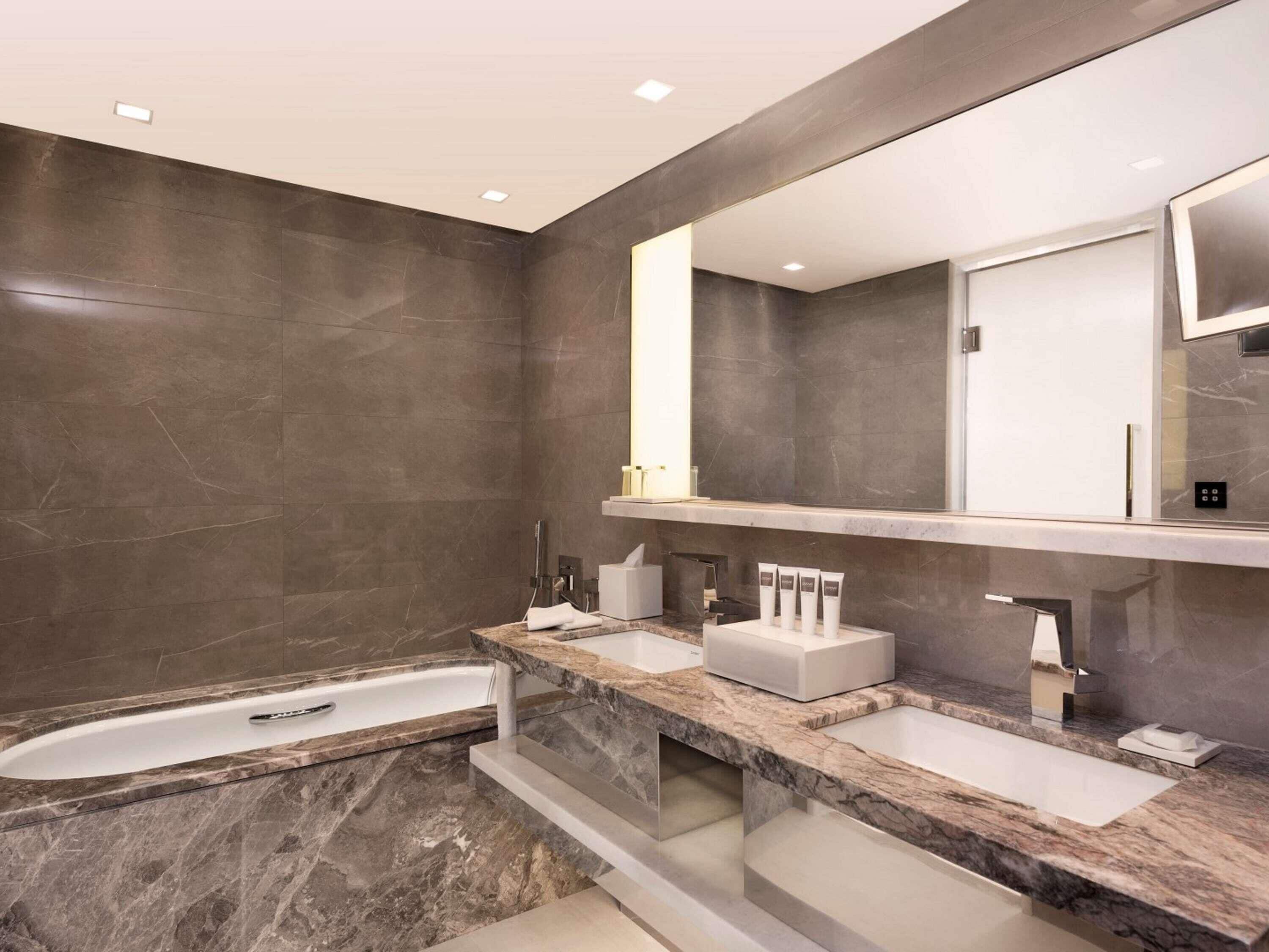 Hydromassage showerhead, designer toiletries, hair dryer, bathrobes