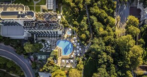 An aerial view of a resort with a swimming pool, multiple buildings, and surrounding greenery. - Swissotel The Bosphorus Istanbul (Istanbul)