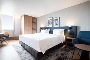 Habitación superior | Ropa de cama de alta calidad y colchones con acolchado adicional