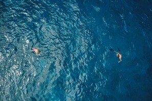 On the beach, scuba diving, windsurfing, kayaking