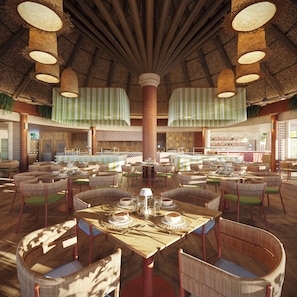 A spacious dining area with high ceilings, wicker furniture, and a central bar.