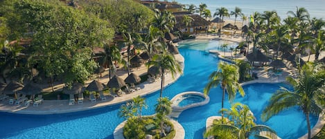 4 outdoor pools, open 7:00 AM to 7:00 PM, pool umbrellas, pool loungers