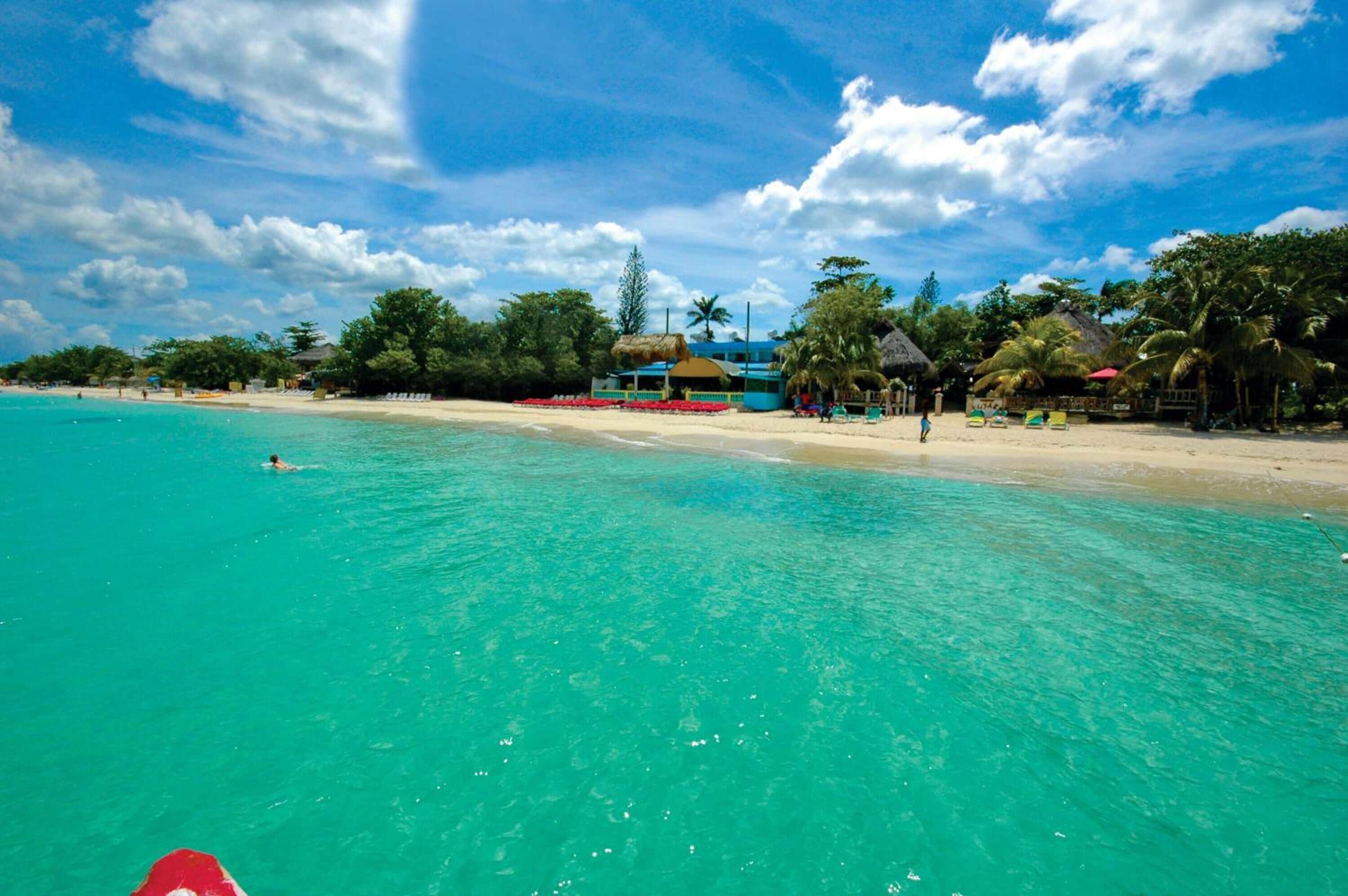 On the beach, white sand, free beach shuttle, sun loungers