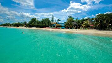 On the beach, white sand, free beach shuttle, sun loungers
