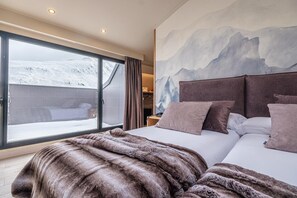 Luxe beddengoed, een minibar, een kluis op de kamer, gratis babybedden