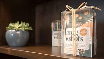 A gift box with a ribbon on a shelf.