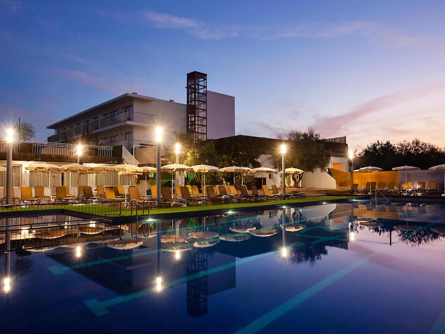 Seasonal outdoor pool, open 11:00 AM to 7:00 PM, pool umbrellas