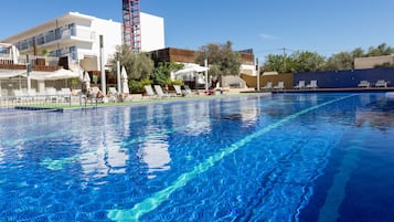 Seasonal outdoor pool, open 11:00 AM to 7:00 PM, pool umbrellas