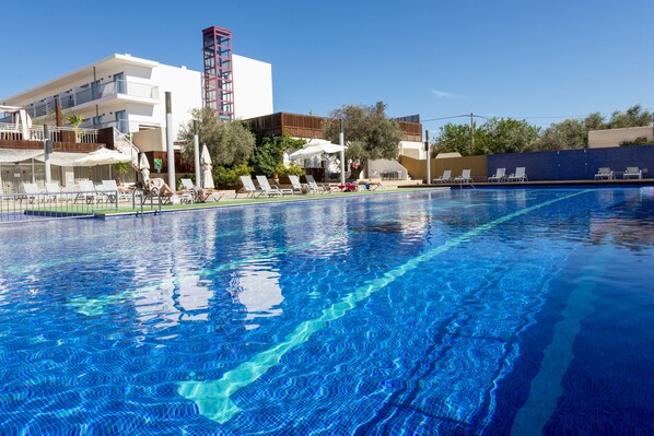 Seasonal outdoor pool, open 11:00 AM to 7:00 PM, pool umbrellas