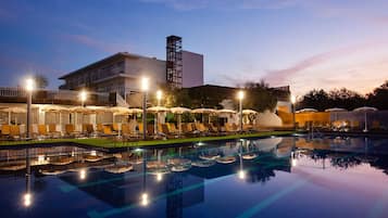 Seasonal outdoor pool, open 11:00 AM to 7:00 PM, pool umbrellas
