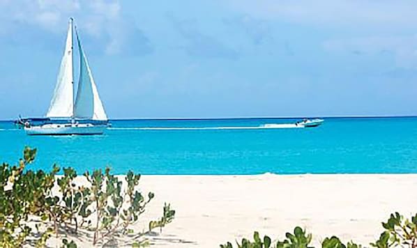 Beach nearby, white sand, sun loungers, beach umbrellas