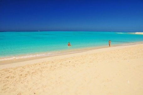 Beach nearby, white sand, sun loungers, beach umbrellas. Inn at Grace Bay