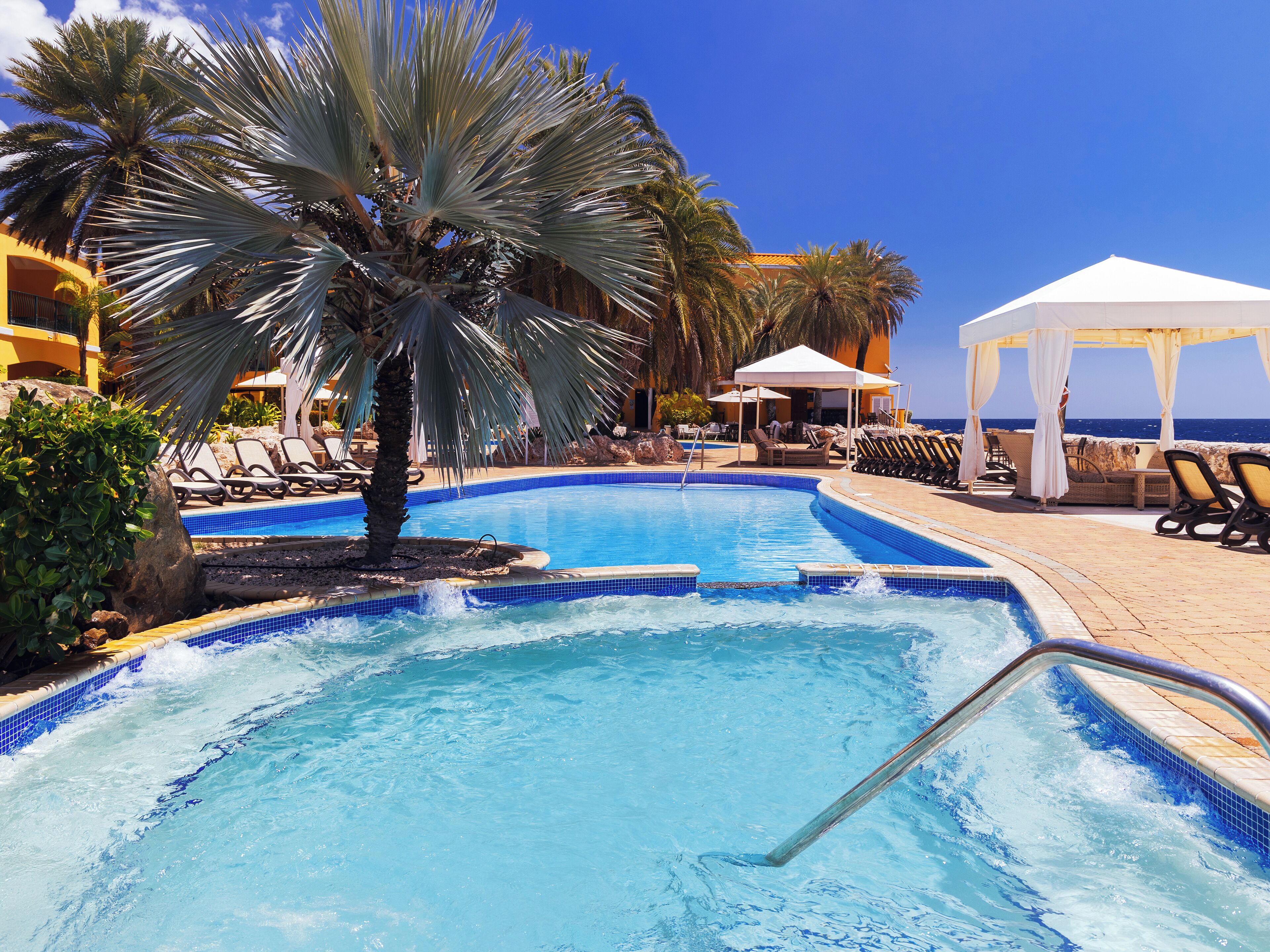 Outdoor pool, free cabanas, pool umbrellas