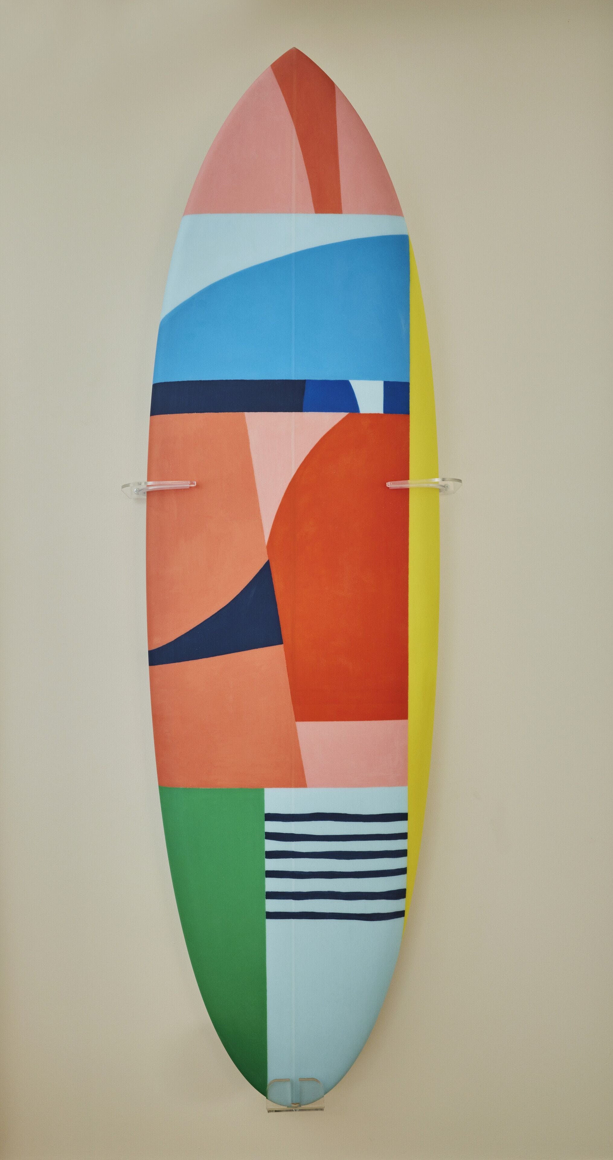 A colorful, abstract artwork on a wall.