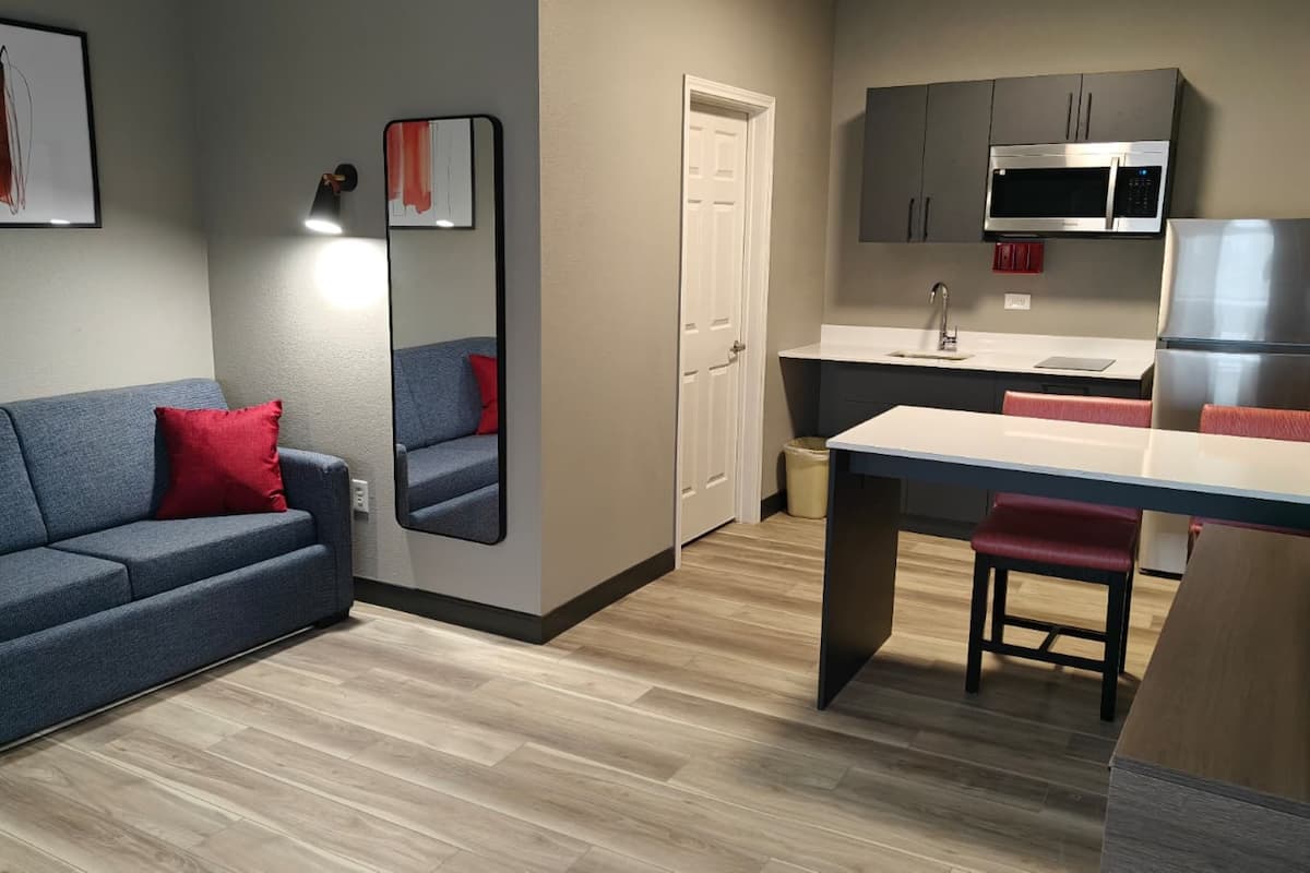 Suite, 2 Queen Beds, Non Smoking | Desk, laptop workspace, iron/ironing board, free WiFi