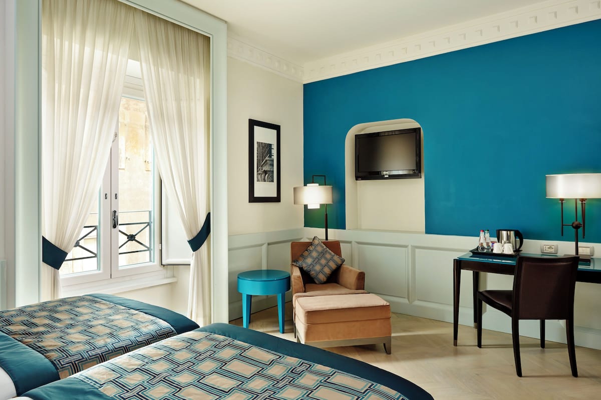 Premium bedding, down duvets, minibar, in-room safe