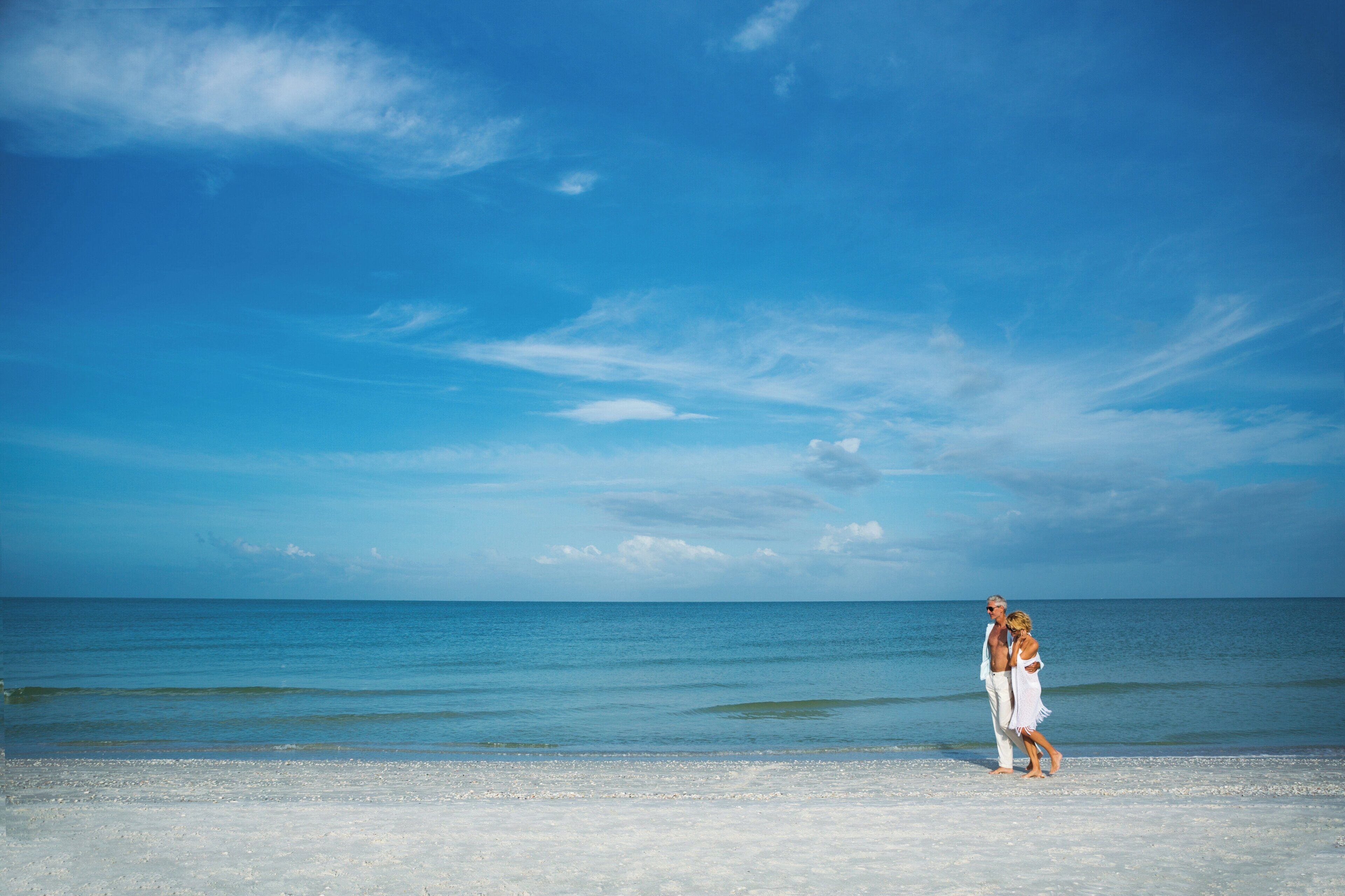 A beach with a clear sky and calm sea.