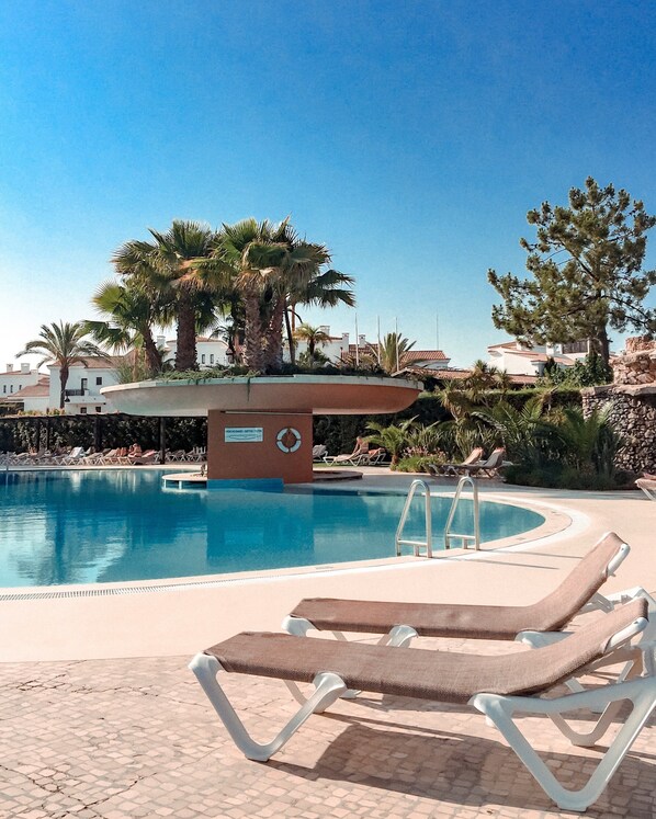 Indoor pool, outdoor pool, open 10:00 AM to 7:00 PM, pool umbrellas