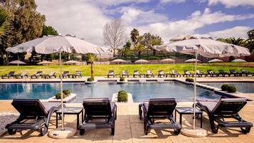 Outdoor pool, open 9 AM to 8 PM, pool loungers