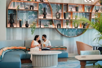 Lobby lounge, pool views, open daily at Hotel Landy Orlando Universal Blvd., a Tribute Portfolio Hotel