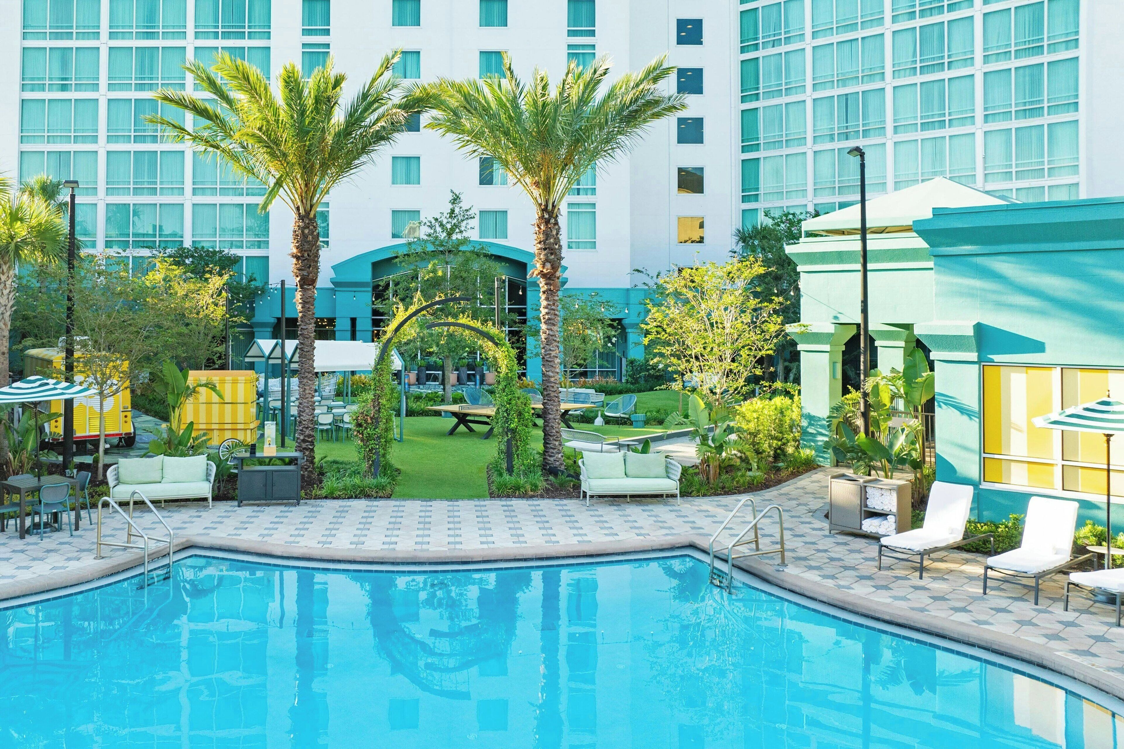 Outdoor pool, open 7:00 AM to 11:00 PM, pool umbrellas, pool loungers