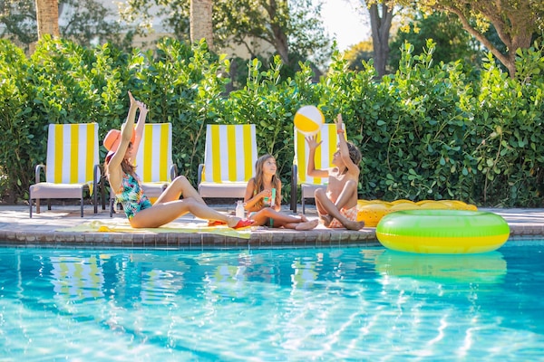 Outdoor pool, open 7:00 AM to 11:00 PM, pool umbrellas, sun loungers