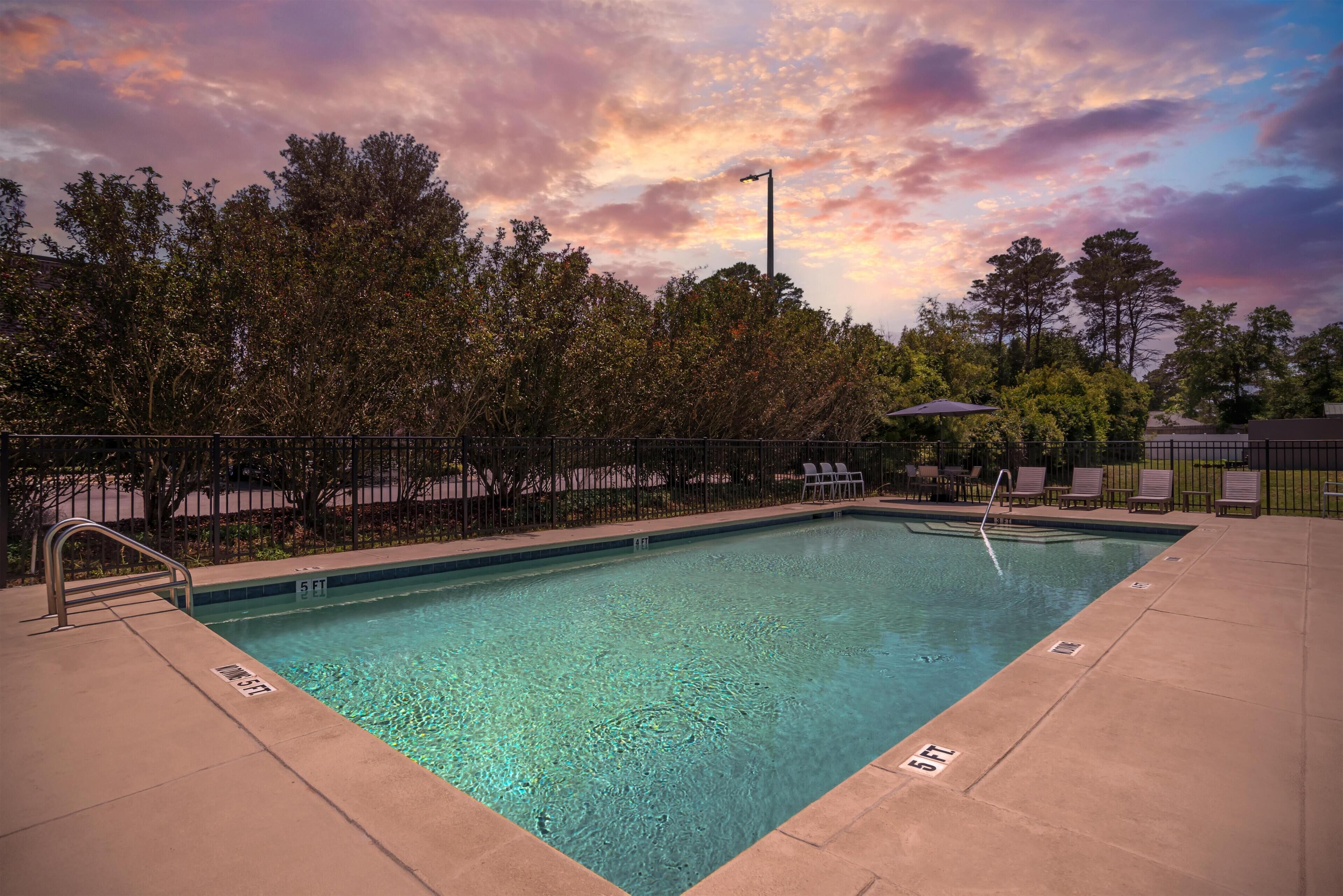 Seasonal outdoor pool, open 8:00 AM to 8:00 PM, pool loungers