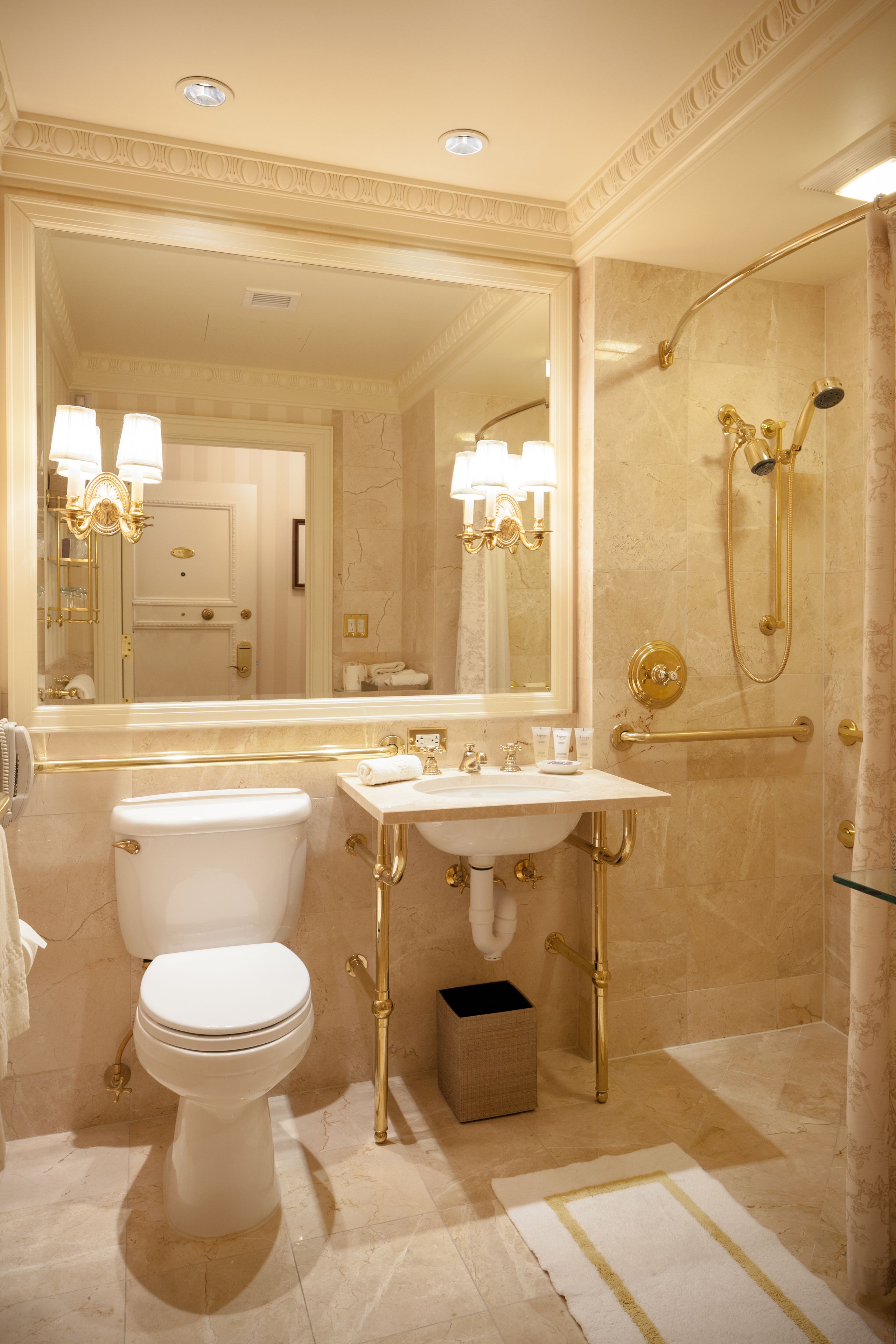 combined shower/bathtub, designer toiletries, hair dryer, bathrobes