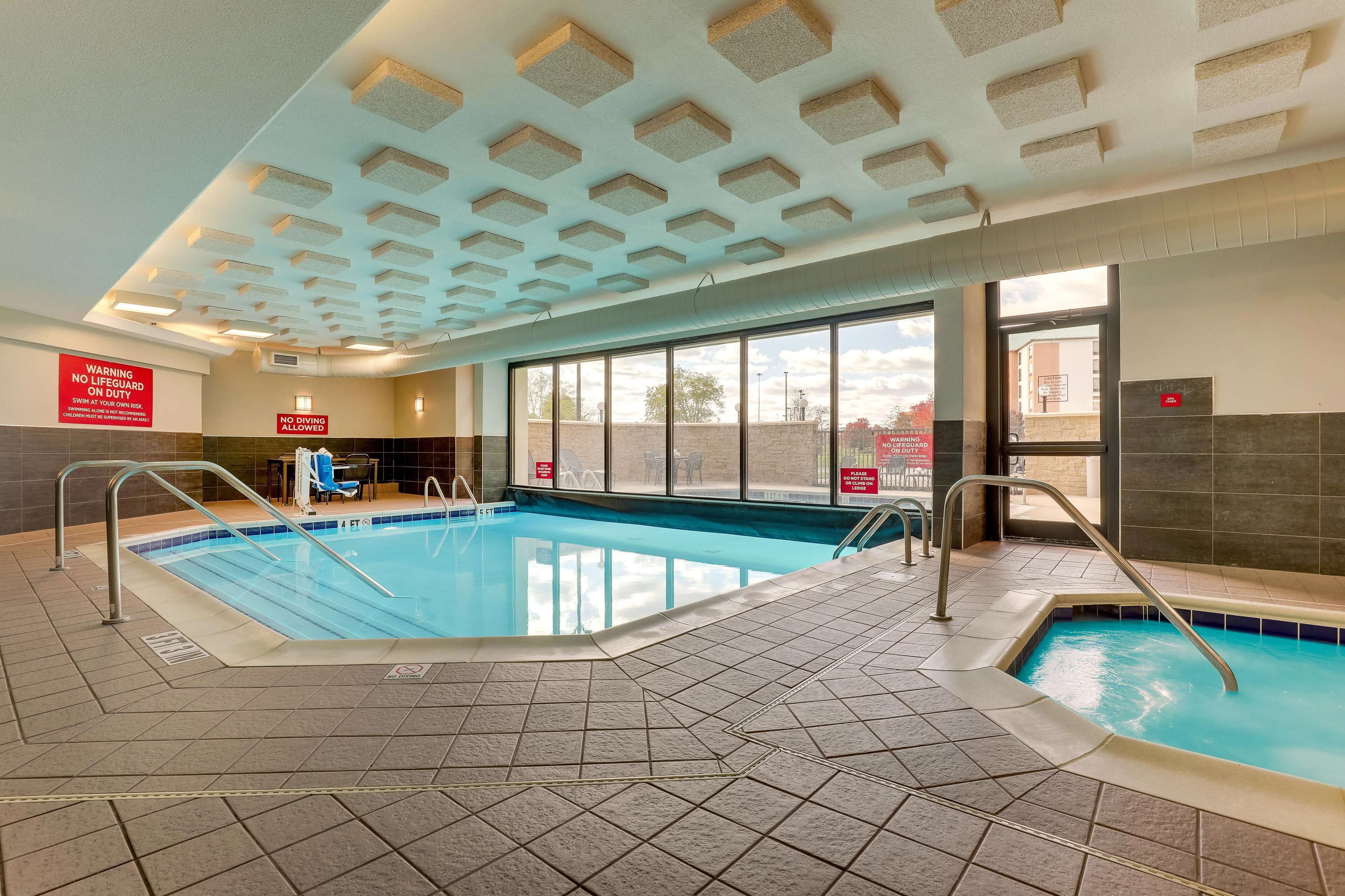 Indoor pool, seasonal outdoor pool, open 9 AM to 10 PM, pool umbrellas