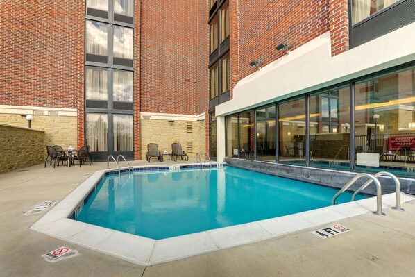 Indoor pool, seasonal outdoor pool, open 9 AM to 10 PM, pool umbrellas