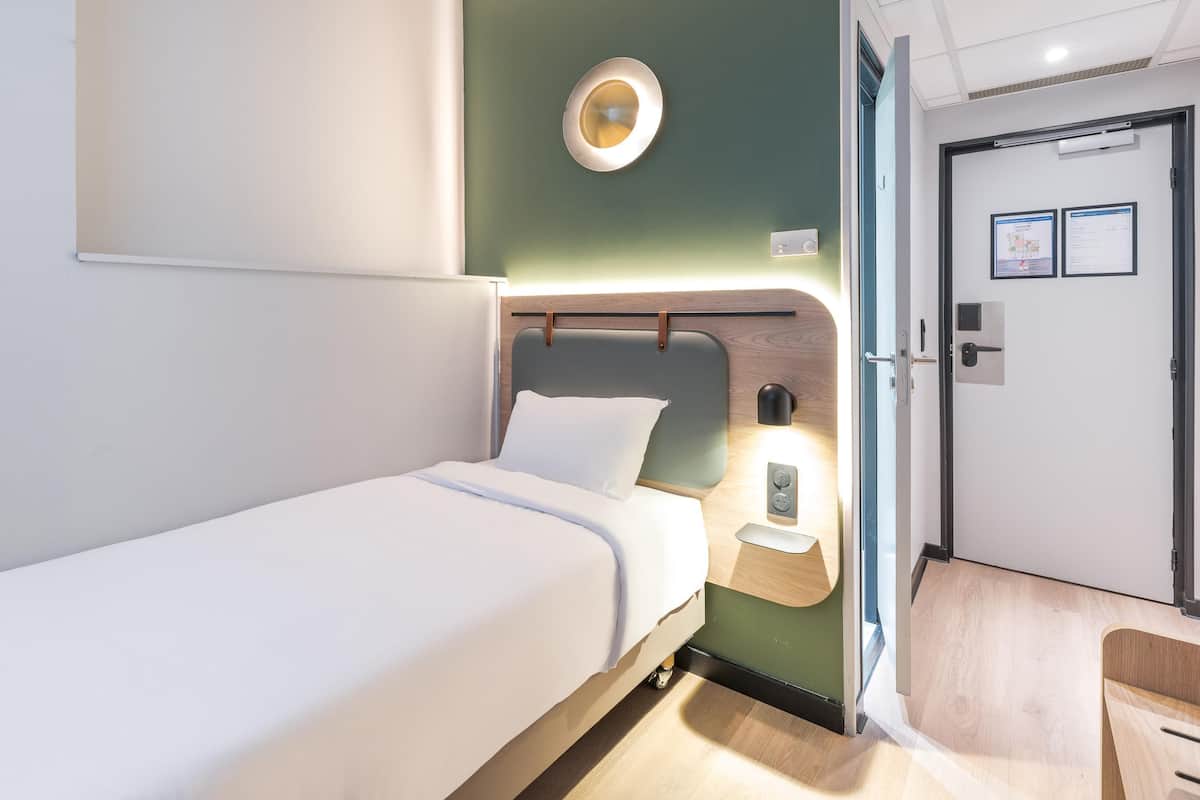 Premium bedding, desk, laptop workspace, blackout curtains