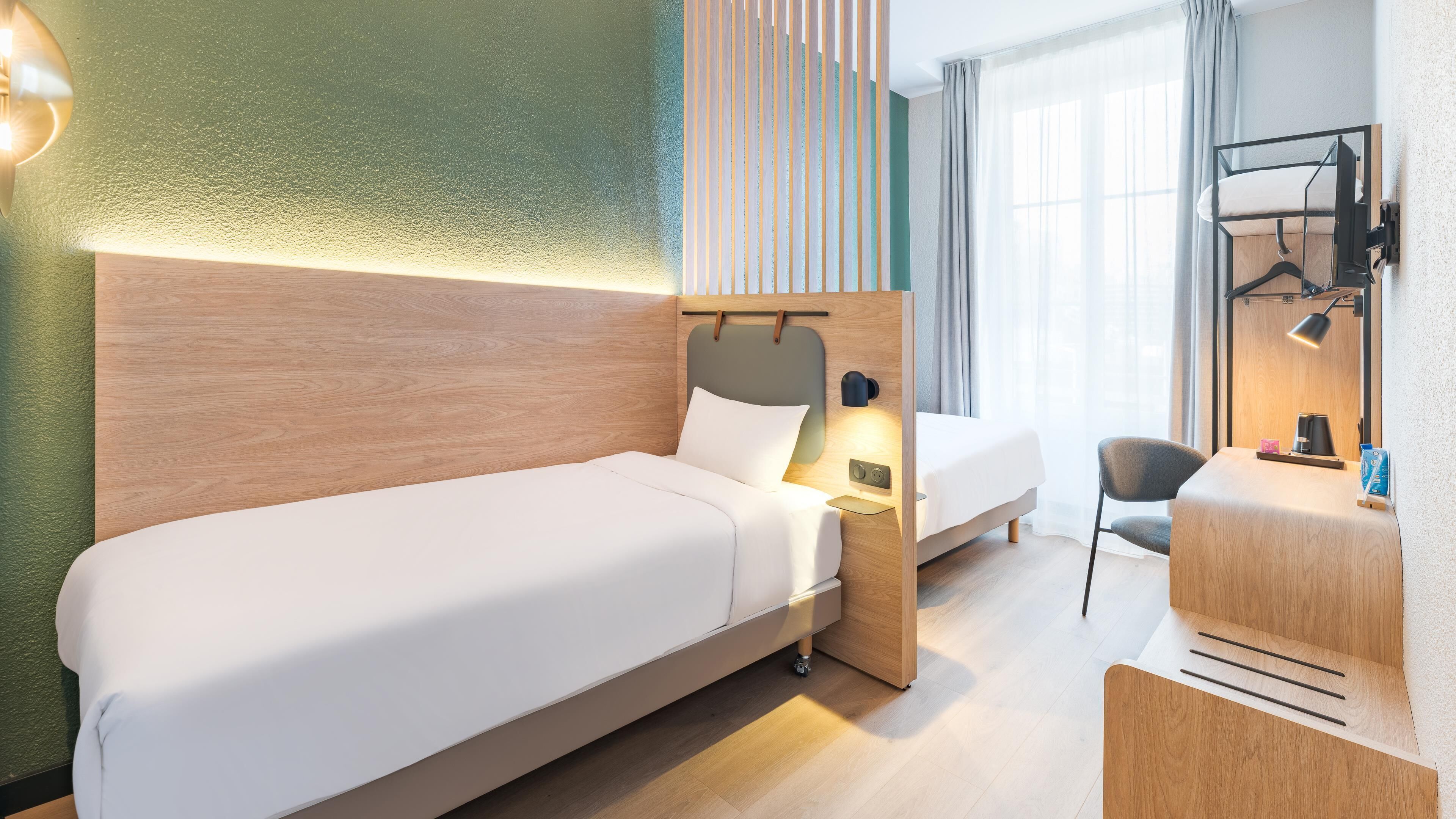 Premium bedding, desk, laptop workspace, blackout curtains