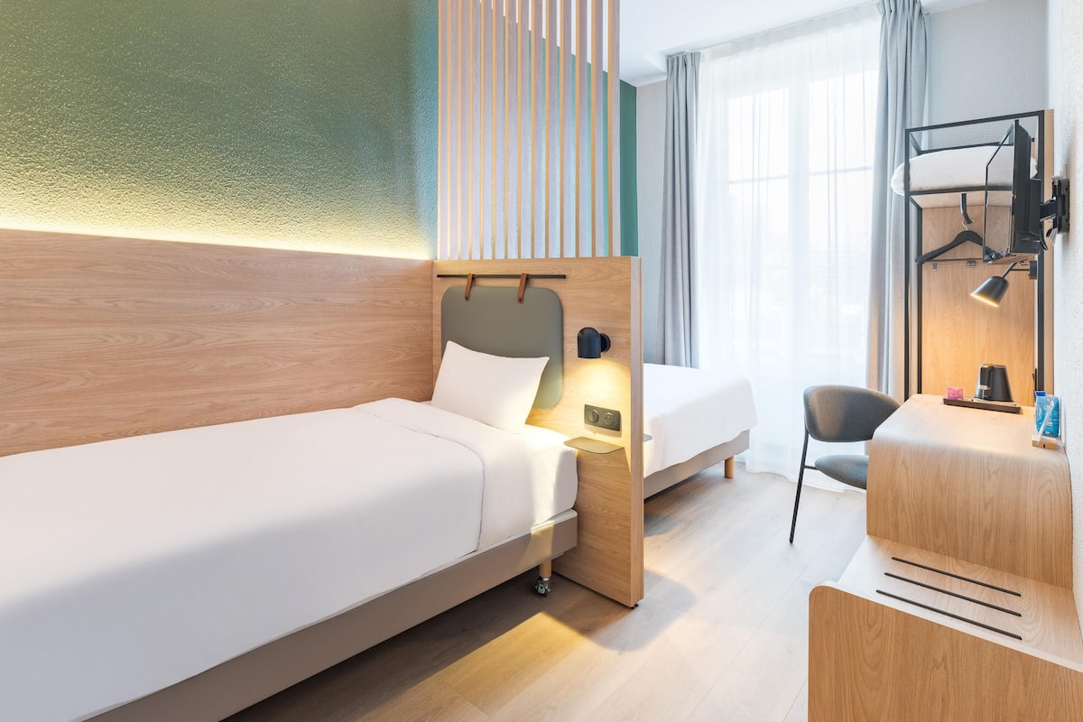 Premium bedding, desk, laptop workspace, blackout curtains