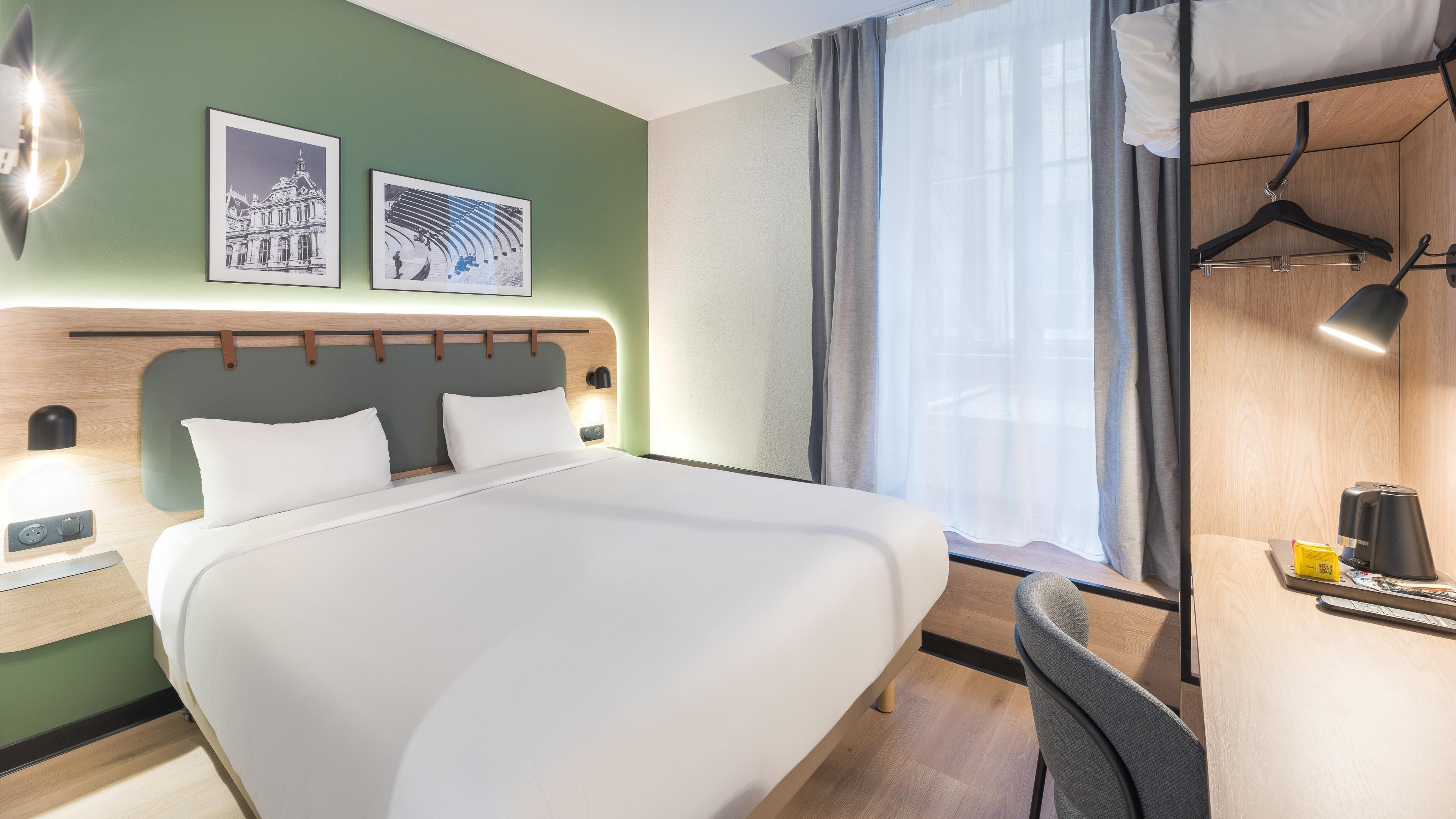 Premium bedding, desk, laptop workspace, blackout drapes