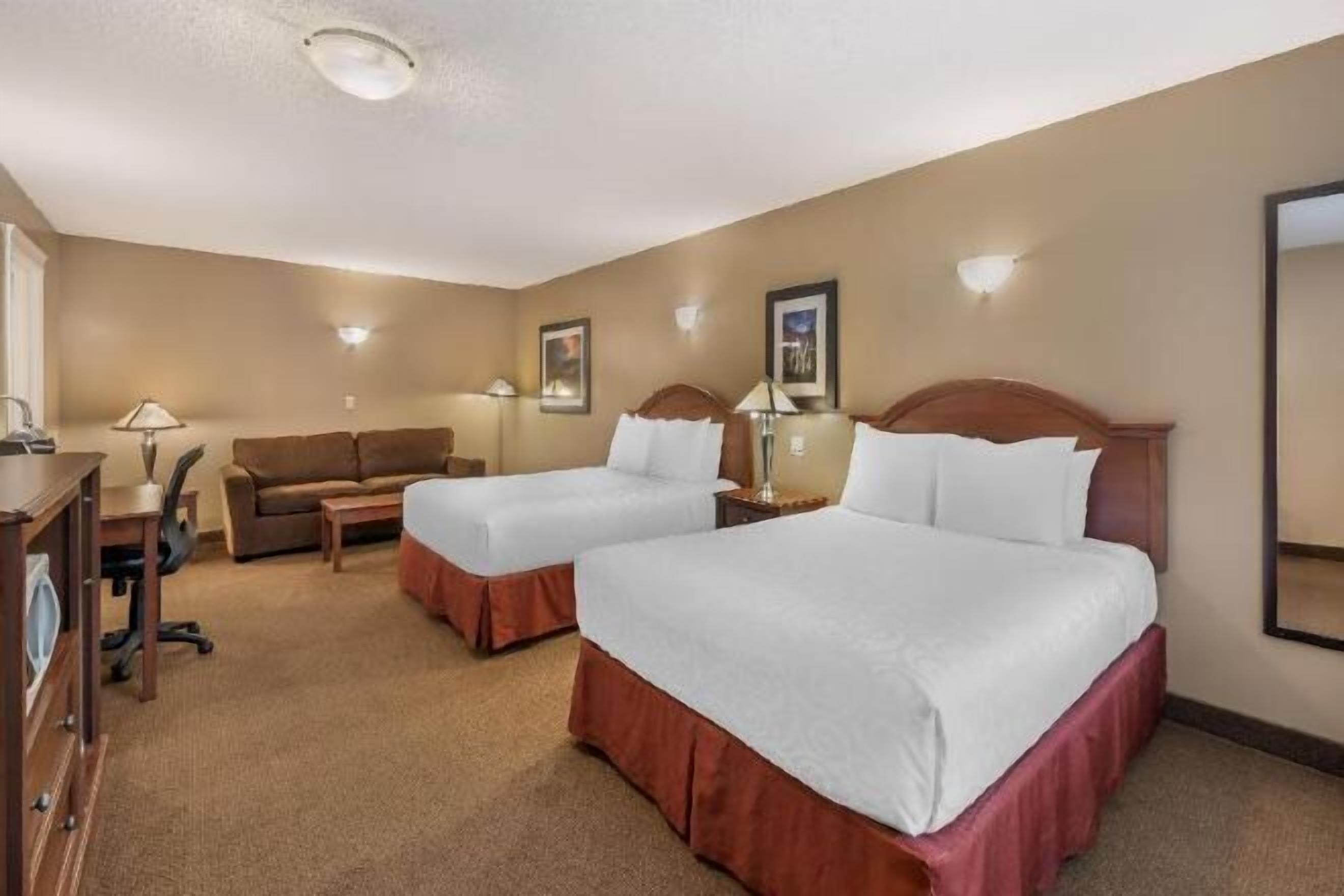 Pillowtop beds, desk, blackout drapes, iron/ironing board