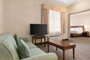 Suite, 1 King Bed | Desk, iron/ironing board, free cribs/infant beds, rollaway beds